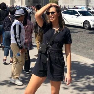 Gilli black denim romper. Front zipper. Pockets. Belted.